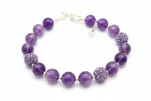 Load image into Gallery viewer, Amethyst and purple rhinestone bracelet with a sterling silver heart clasp in a white box.