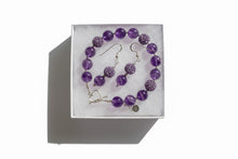 Load image into Gallery viewer, Amethyst and purple rhinestone bracelet with a sterling silver heart clasp and coordinating earrings in a white box.