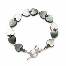 Load image into Gallery viewer, Bracelet with heart shaped beads accented by faceted tiny purple rondelles and sterling silver beads and clasp against a white background.