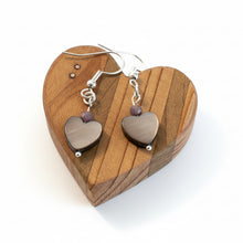 Load image into Gallery viewer, Iridescent Heart-shaped earrings on a wooden heart-shaped stand
