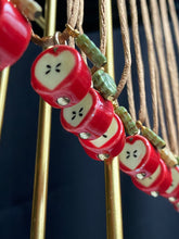 Load image into Gallery viewer, Close up of Red Apple Pendant Necklaces in a row