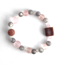 Load image into Gallery viewer, Pink Glass and Mother of Pearl beads are set off by a complementary glass accent bead and pink lava stone. Apply 1-2 drops of your favorite essential oil to your lava bead Size: 6