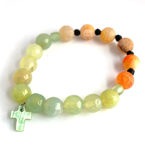 Beautiful expression of faith. Orange Crackle beads and green Agates, with green glass accent beads and cross. Stretch bracelet Size 6 1/2