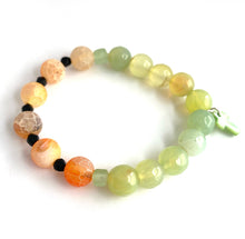 Load image into Gallery viewer, Beautiful expression of faith. Orange Crackle beads and green Agates, with green glass accent beads and cross. Stretch bracelet Size 6 1/2
