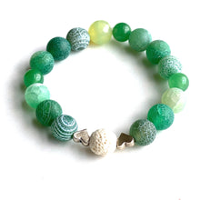 Load image into Gallery viewer, Breathe deep your favorite earthy essential oil applied to your white Lava bead. Picture the green hills as you look upon the rich greens of Aventurine and Agates. Silver hearts envelope the white Lava bead. Type: Diffuser Stretch Bracelet Size: 6 Bead sizes: 8mm, 10mm