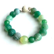 Load image into Gallery viewer, Breathe deep your favorite earthy essential oil applied to your white Lava bead. Picture the green hills as you look upon the rich greens of Aventurine and Agates. Silver hearts envelope the white Lava bead. Type: Diffuser Stretch Bracelet Size: 6 Bead sizes: 8mm, 10mm