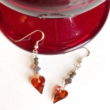 Load image into Gallery viewer, A radiant red crystal heart dangles from gray quartz and Sterling Silver ear wires. Simple, stately sentiment of love. Collection: Jo Color: Red Drop Length: 2 inches Materials: Swarovski crystal, quartz Metals: mixed, .925 Sterling Silver ear wires