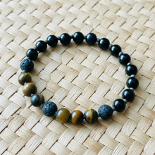 Load image into Gallery viewer, Beaded essential oil bracelet on a light woven mat
