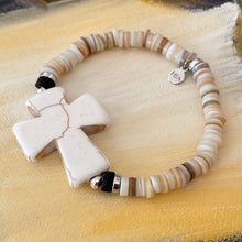 Load image into Gallery viewer, Essential Oil Bracelet with Large Cross Focal in Crackle Beige, Black Lava Beads, Shell Heishi Disks
