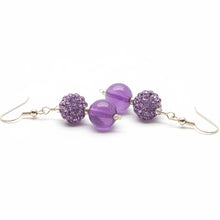 Load image into Gallery viewer, Purple beaded earrings on a white background
