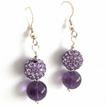 Load image into Gallery viewer, Purple beaded earrings with silver hooks on a white background

