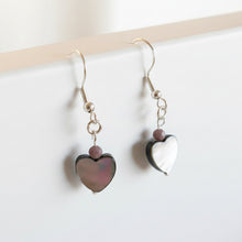 Load image into Gallery viewer, Heart-shaped earrings with purple and white stones on a white background
