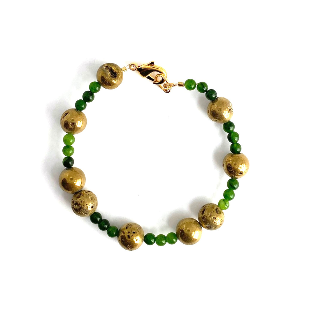 Golden Agates sparkle in contrast to the pure green Jade beads. 14K gold-plated clasp gives this bracelet an elegant appeal.   Type: Clasp Bracelet Size: 7