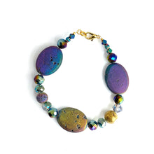 Load image into Gallery viewer, Iridescent ovals that sparkle in shades of blue, purple, golds and greens are complemented by faceted glass and a solitary Golden Agate. 14K gold-plated lobster clasp make this diffuser bracelet both functional and elegant. Apply 1-2 drops of your favorite essential oil to the iridescent lava bead. Breathe and smile.  Type: Diffuser Clasp Bracelet Size: 7
