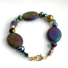 Load image into Gallery viewer, Iridescent ovals that sparkle in shades of blue, purple, golds and greens are complemented by faceted glass and a solitary Golden Agate. 14K gold-plated lobster clasp make this diffuser bracelet both functional and elegant. Apply 1-2 drops of your favorite essential oil to the iridescent lava bead. Breathe and smile.  Type: Diffuser Clasp Bracelet Size: 7
